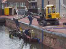 Fixin canal walls in Amsterdam